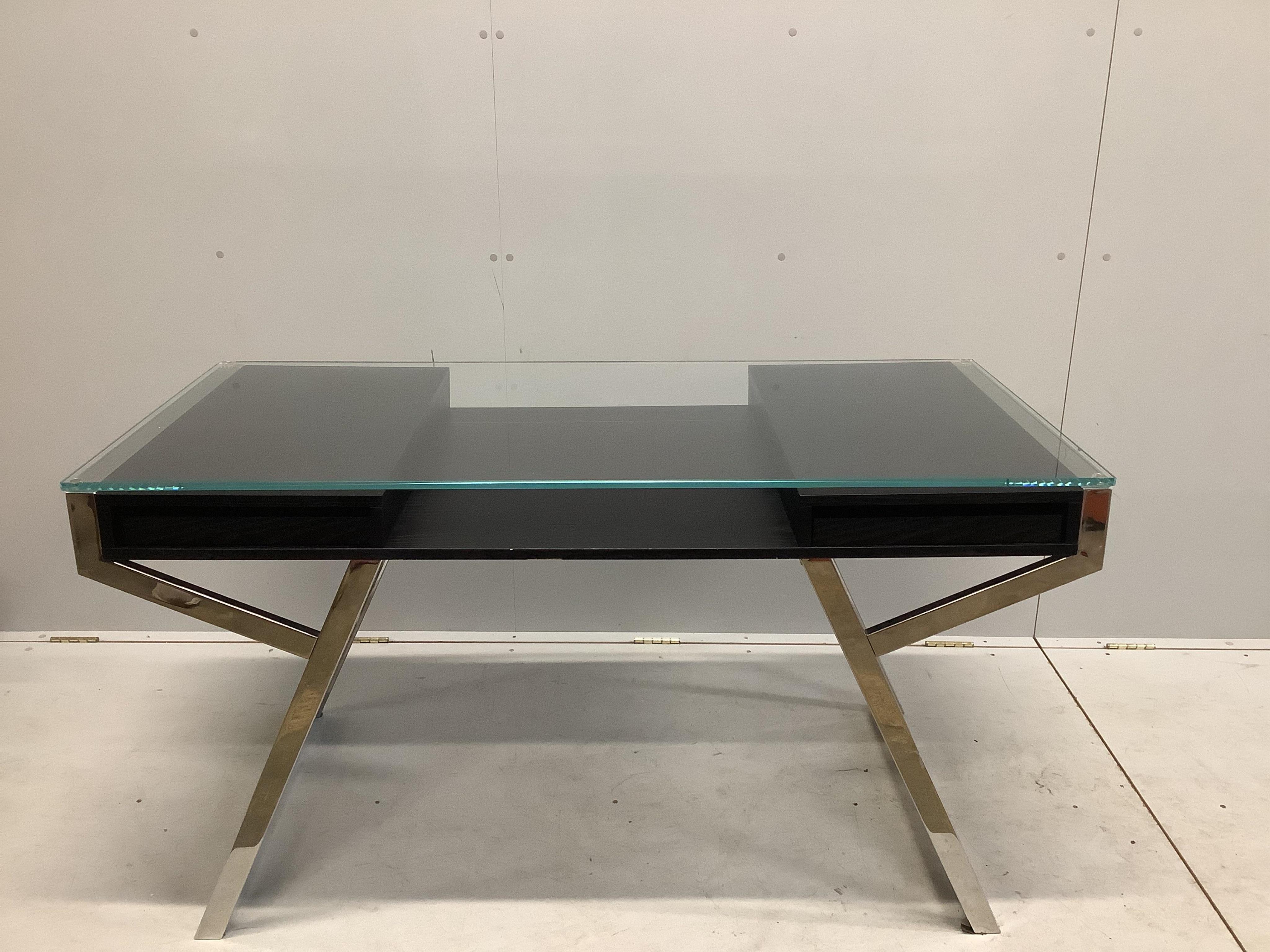 A Contemporary ash and chrome glass topped desk, width 140cm, depth 65cm, height 75cm. Condition - fair